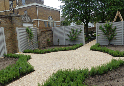 Beautiful landscaped gravel path surrounded by plants